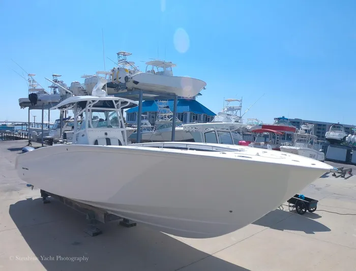 Higher Power Yacht Photos Pics 2017 Cape Horn 36XS boat docked at a marina under a clear blue sky.