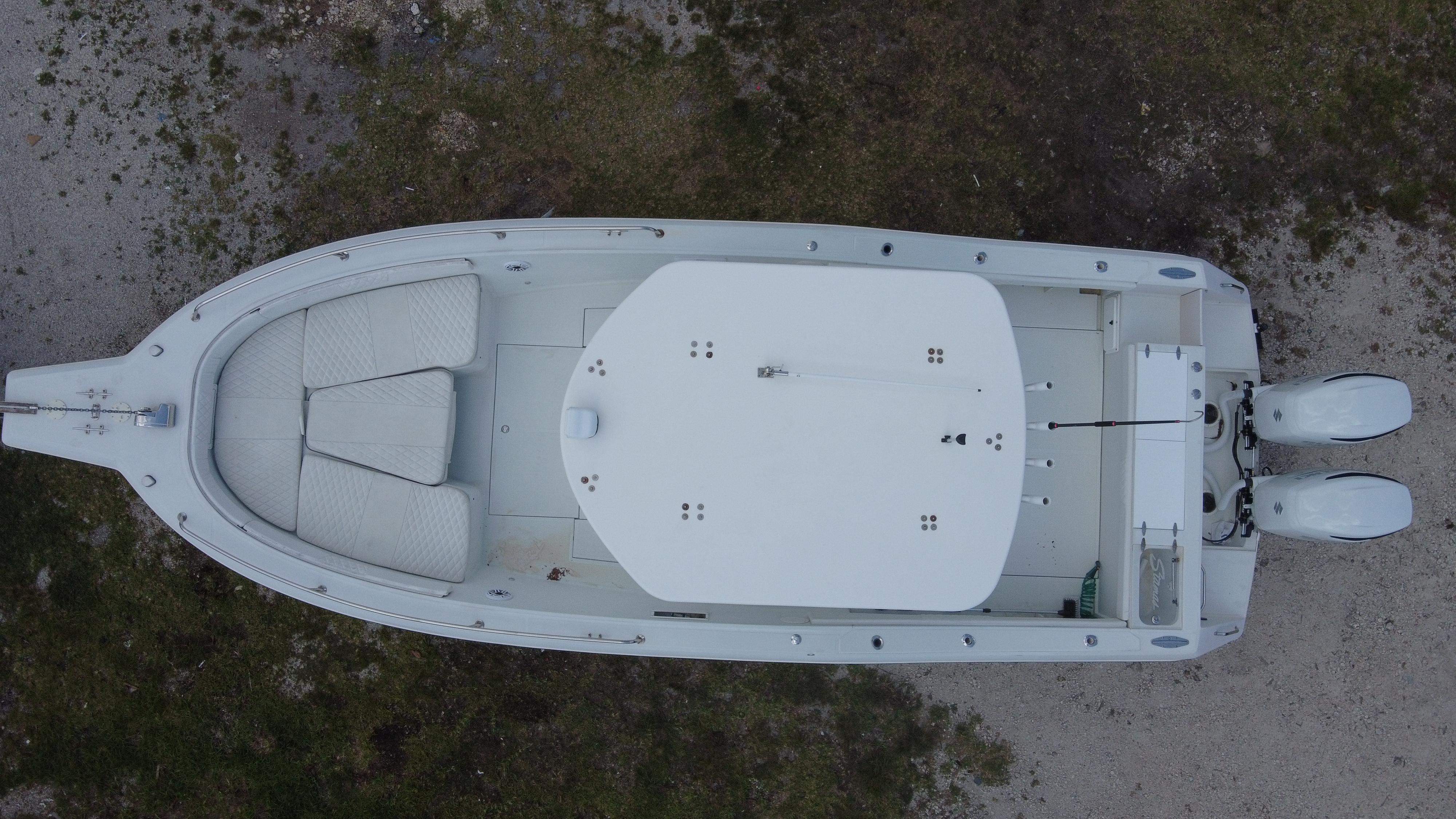 Overhead view of a 1997 Stamas 290 Tarpon boat on land.
