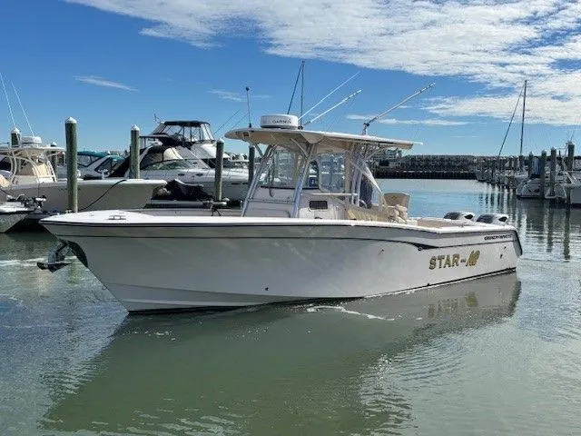 Star-k-2 Yacht Photos Pics 2008 Grady-White Bimini 306 boat docked in a marina under a clear blue sky.