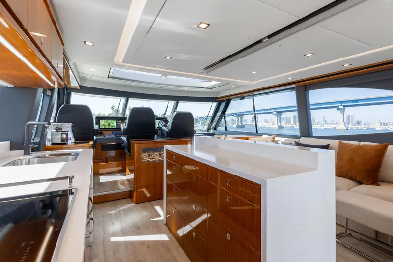 Hermosa Yacht Photos Pics Luxurious interior of 2022 Riviera 645 SUV yacht with modern design and panoramic windows.
