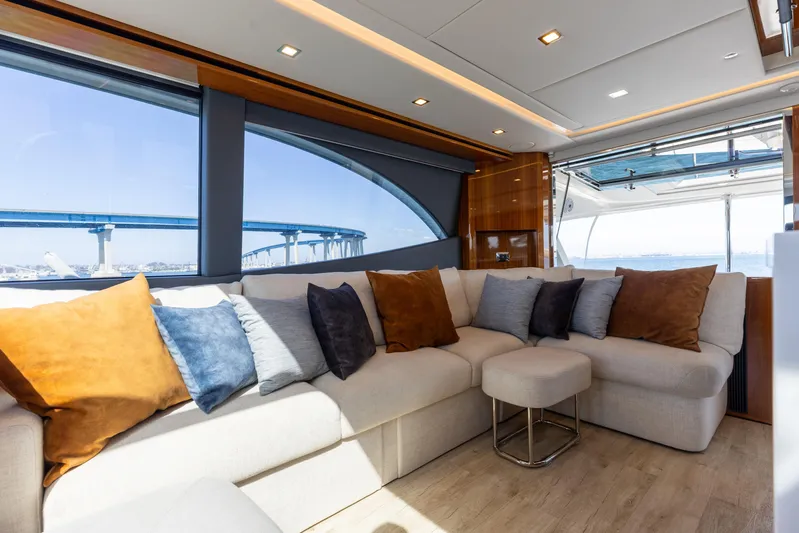 Hermosa Yacht Photos Pics Luxurious interior of 2022 Riviera 645 SUV yacht with plush seating and scenic views.