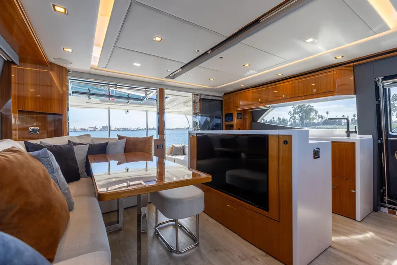 Hermosa Yacht Photos Pics Luxurious interior of 2022 Riviera 645 SUV yacht with modern furnishings and scenic views.