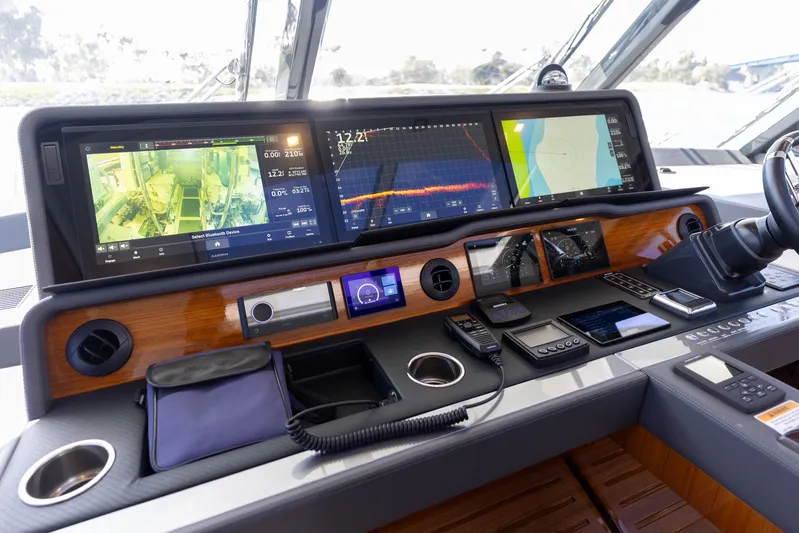 Hermosa Yacht Photos Pics Control panel of 2022 Riviera 645 SUV yacht with advanced navigation displays and controls.