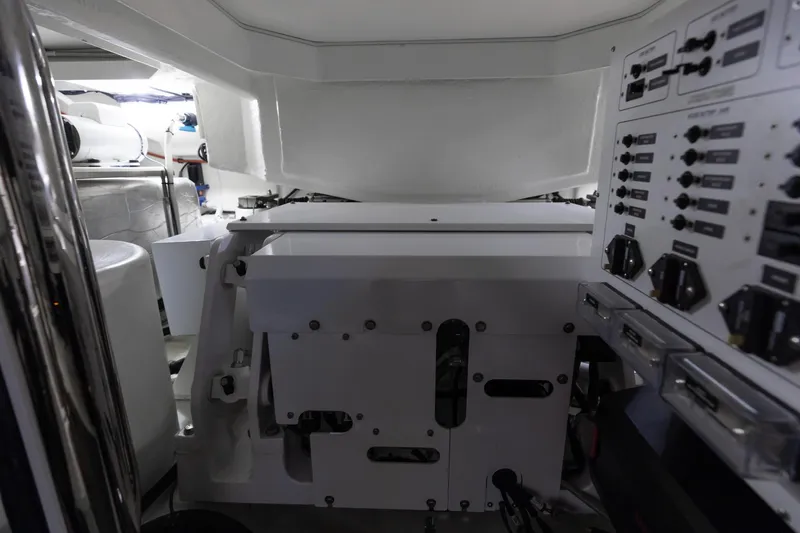 Hermosa Yacht Photos Pics Engine room of 2022 Riviera 645 SUV with control panels and machinery.