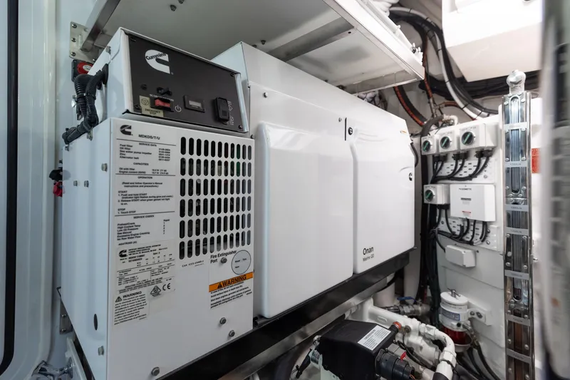 Hermosa Yacht Photos Pics Engine room of 2022 Riviera 645 SUV with Cummins generator and electrical systems.