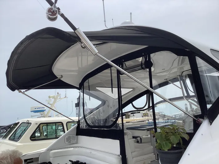 Dorado Yacht Photos Pics 2007 Regal Commodore 4460 yacht with black canopy at marina.