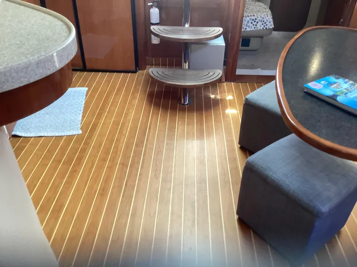 Dorado Yacht Photos Pics Interior of 2007 Regal Commodore 4460 yacht with wooden flooring and modern seating.