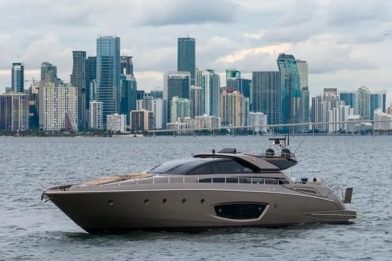 Da Rose Yacht Photos Pics Luxury Riva 86' DOMINO yacht cruising near a city skyline, 2012 model.