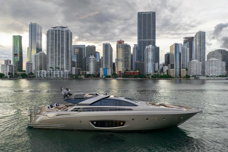 Da Rose Yacht Photos Pics Luxurious 2012 Riva 86' DOMINO yacht cruising near a modern city skyline.