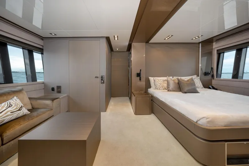 Da Rose Yacht Photos Pics Luxurious interior of 2012 Riva 86' DOMINO yacht with modern bedroom and seating area.