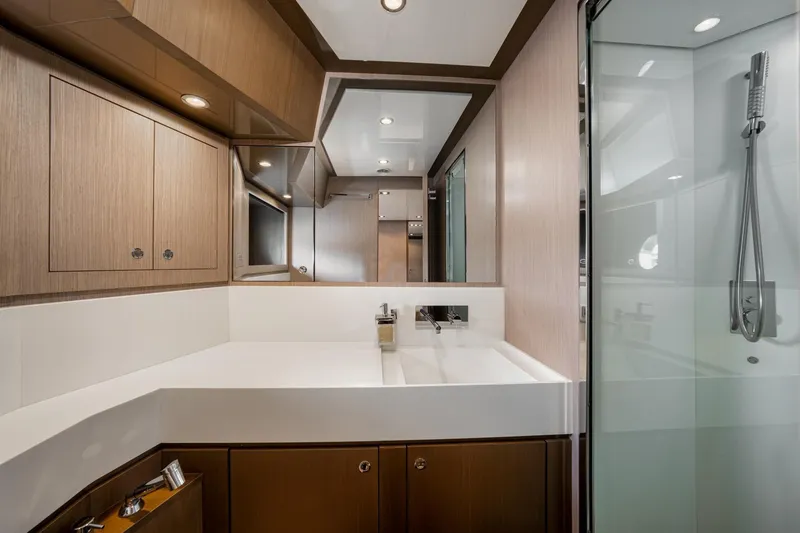 Da Rose Yacht Photos Pics Luxurious bathroom interior of 2012 Riva 86' DOMINO yacht with modern fixtures and wood accents.