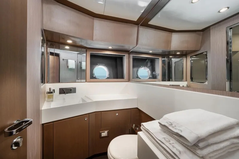 Da Rose Yacht Photos Pics Luxurious bathroom interior of 2012 Riva 86' DOMINO yacht with modern fixtures and porthole windows.