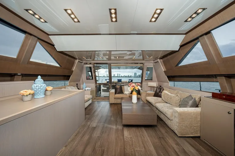 Da Rose Yacht Photos Pics Luxurious interior of 2012 Riva 86' DOMINO yacht with elegant seating and panoramic windows.