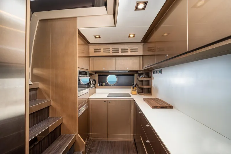 Da Rose Yacht Photos Pics Luxurious kitchen interior of 2012 Riva 86' DOMINO yacht with modern cabinetry and appliances.
