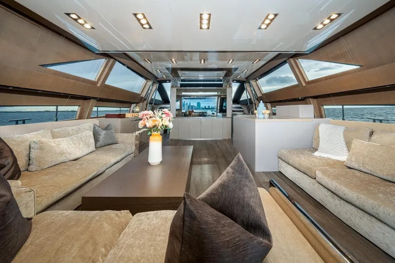 Da Rose Yacht Photos Pics Luxurious interior of 2012 Riva 86' DOMINO yacht with elegant seating and panoramic windows.