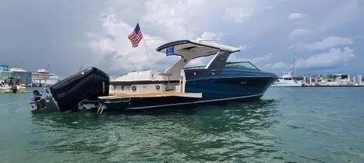 Kelly's Buoys Yacht Photos Pics 2021 Sea Ray 400 SLX OB luxury boat on water with American flag.