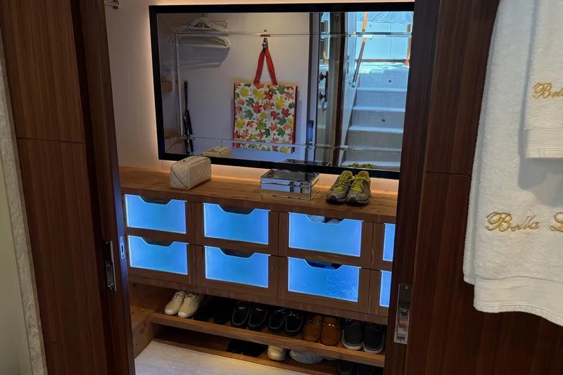 Bella Lisa Yacht Photos Pics Luxurious closet interior on 2020 Ocean Alexander 100 Skylounge Megayacht, featuring illuminated shoe storage.