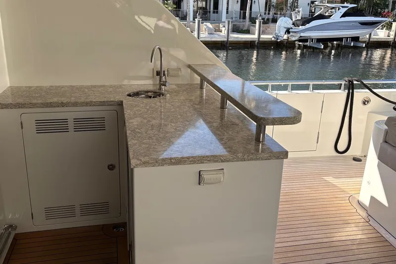 Bella Lisa Yacht Photos Pics Outdoor kitchenette on 2020 Ocean Alexander 100 Skylounge Megayacht with sink and countertop.