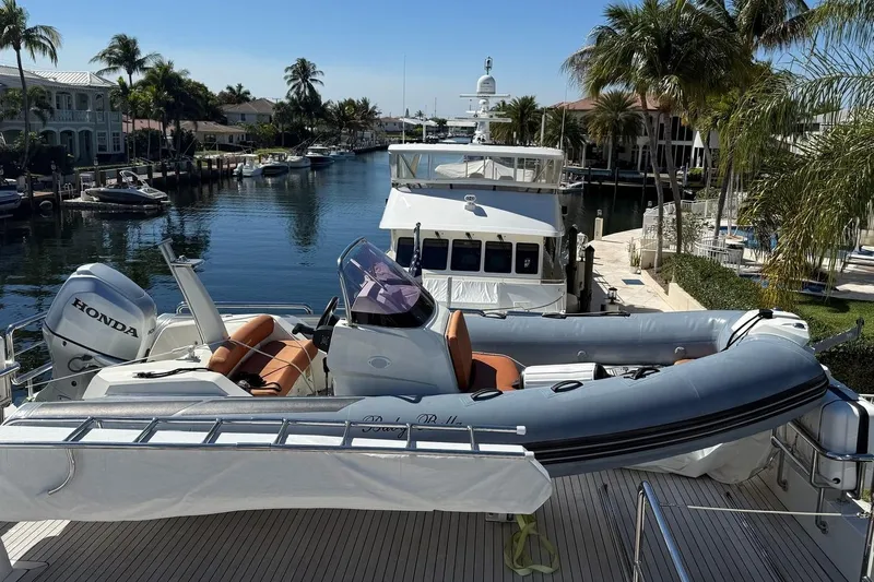 Bella Lisa Yacht Photos Pics 2020 Ocean Alexander 100 Skylounge Megayacht docked with inflatable boat and Honda motor.