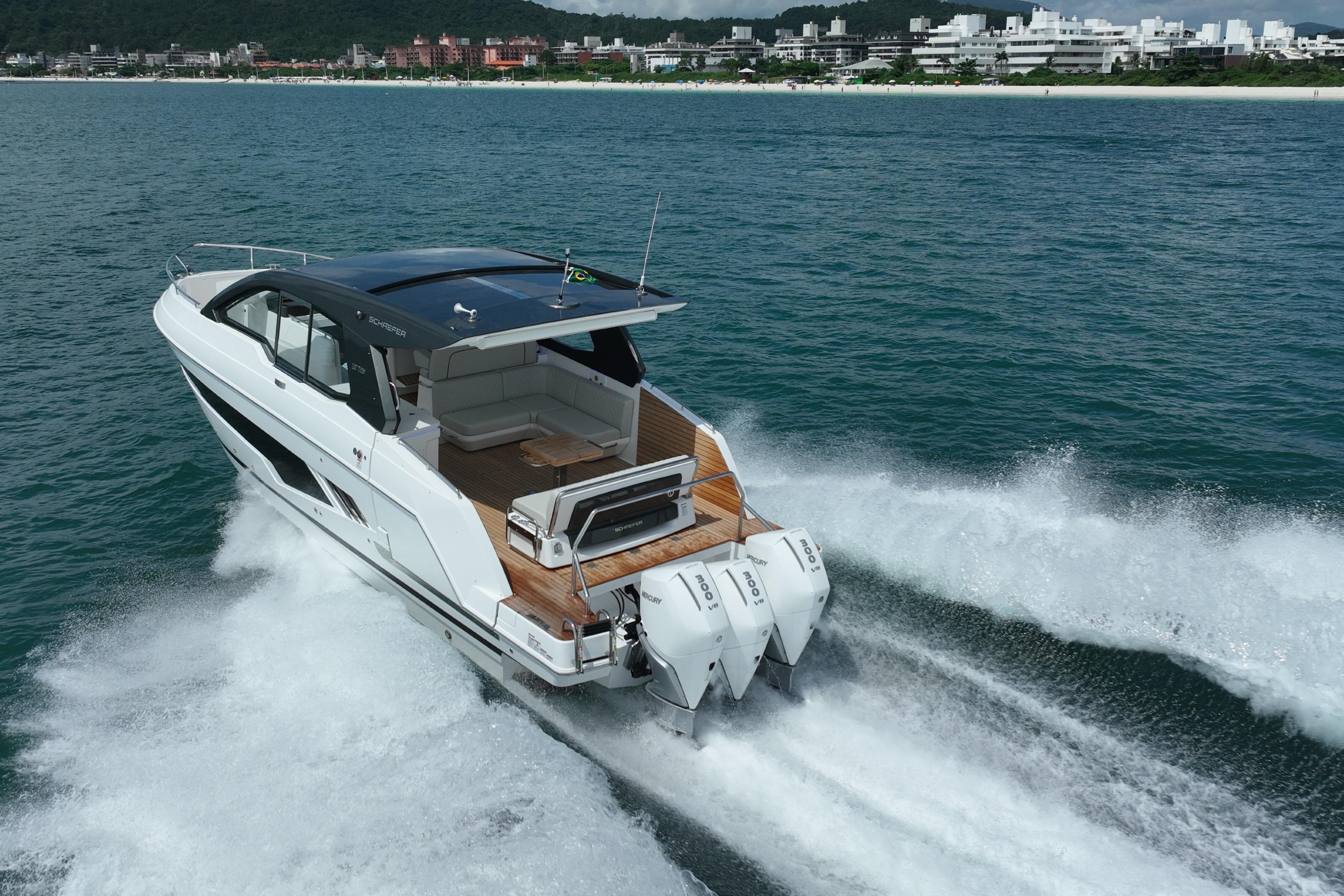 2026 Schaefer 375 yacht cruising on ocean near coastline.