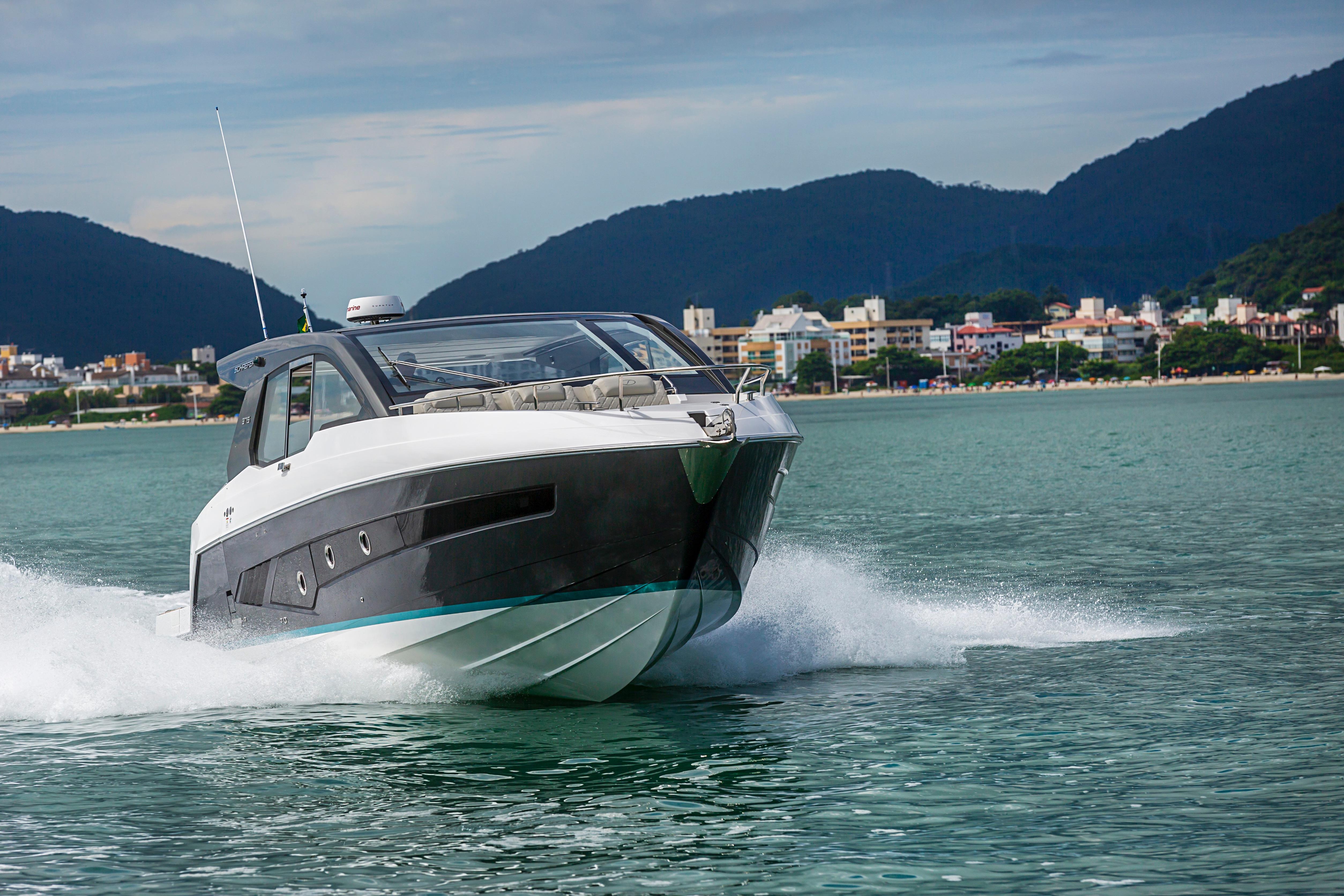 2026 Schaefer 375 yacht cruising on a scenic coastal waterway.