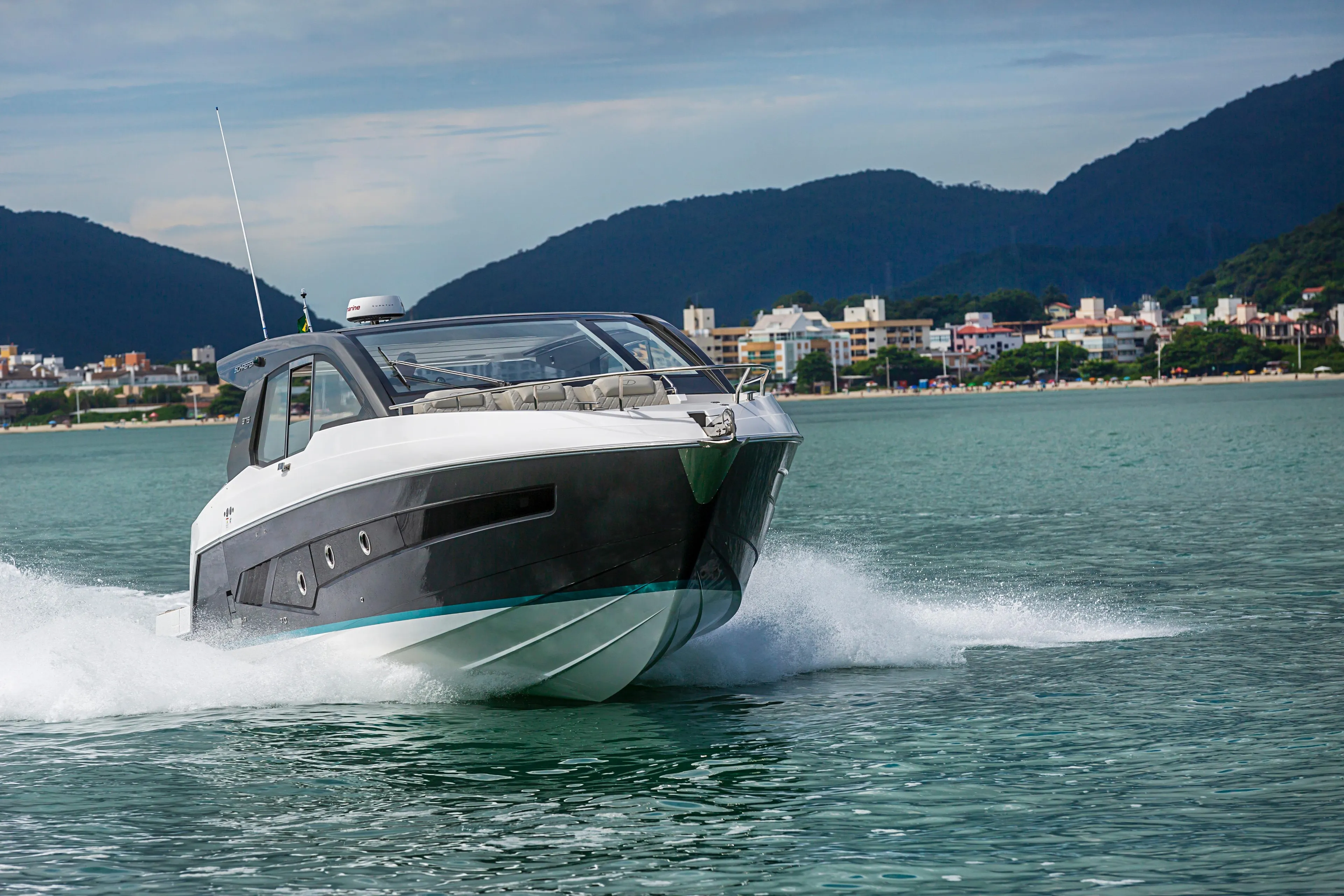 2026 Schaefer 375 yacht cruising on a scenic coastal waterway.