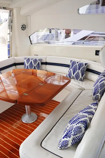  Yacht Photos Pics Luxurious Sunseeker Predator 74 yacht interior with elegant seating and wooden table, 2000 model.