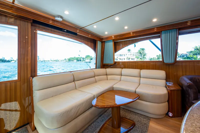 Blind Date Yacht Photos Pics Luxurious interior of 2016 Viking 46 Convertible yacht with plush seating and scenic windows.