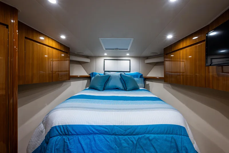 Blind Date Yacht Photos Pics Luxurious cabin interior of 2016 Viking 46 Convertible yacht with cozy bedding.