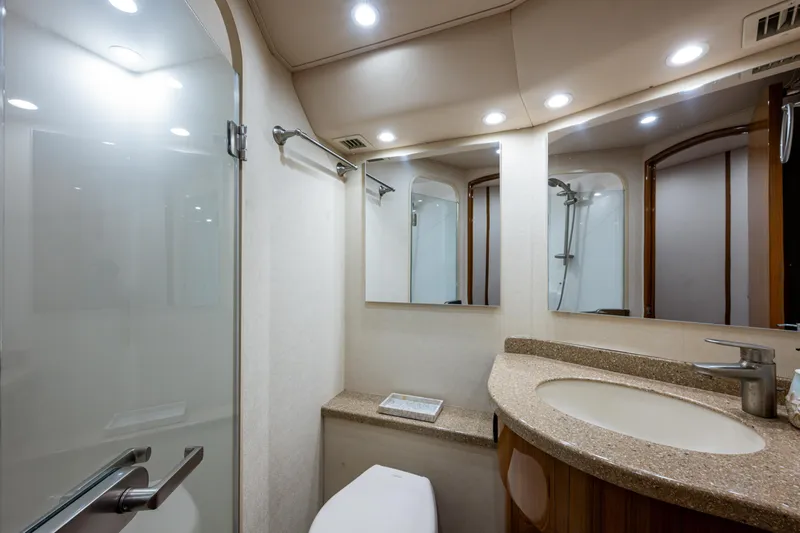 Blind Date Yacht Photos Pics Luxurious bathroom interior of 2016 Viking 46 Convertible yacht with modern fixtures.