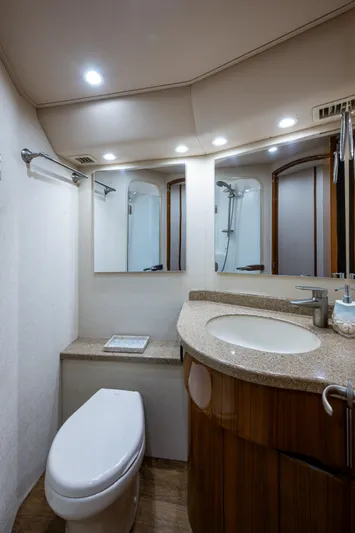 Blind Date Yacht Photos Pics Luxurious bathroom in 2016 Viking 46 Convertible yacht with modern fixtures and elegant design.