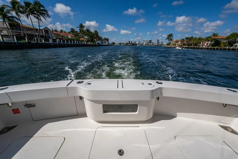 Blind Date Yacht Photos Pics 2016 Viking 46 Convertible yacht cruising on a sunny day, with scenic waterfront views.