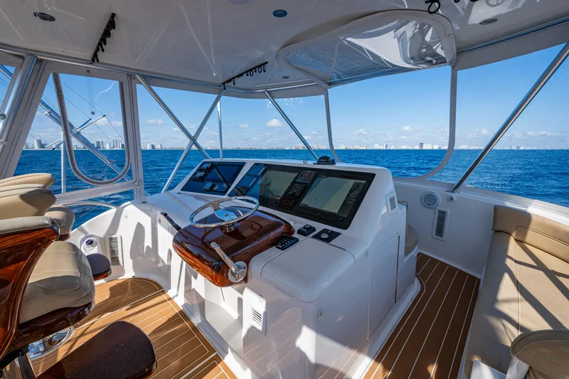 Blind Date Yacht Photos Pics 2016 Viking 46 Convertible yacht helm with ocean view and modern navigation equipment.