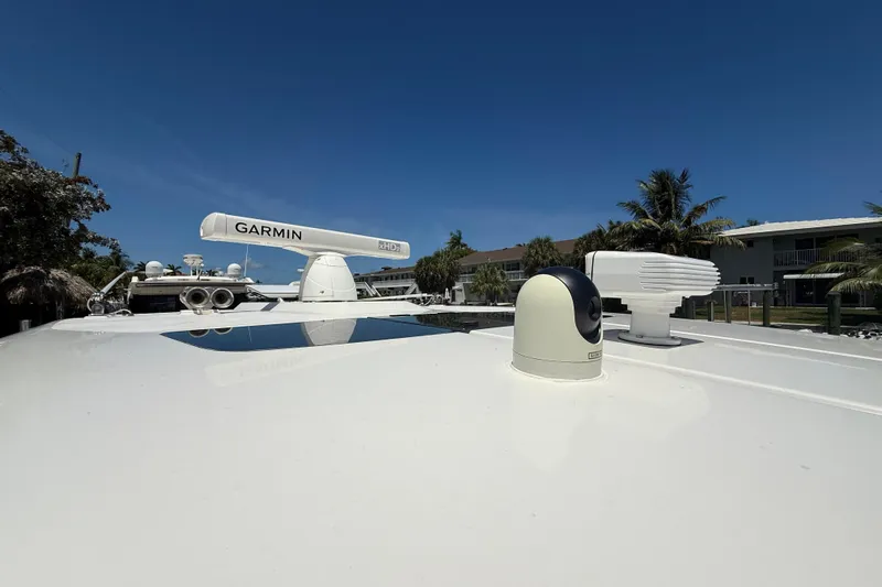  Yacht Photos Pics 2019 Tiara Sport 38 LS boat with Garmin radar and clear blue sky.