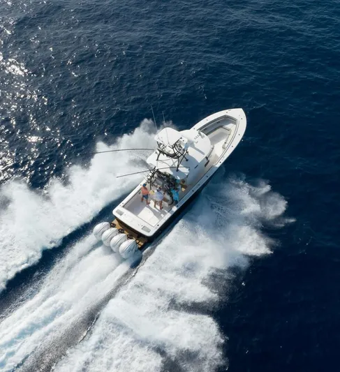  Yacht Photos Pics Aerial view of 2025 Regulator 41 CC boat cruising on open ocean waters.