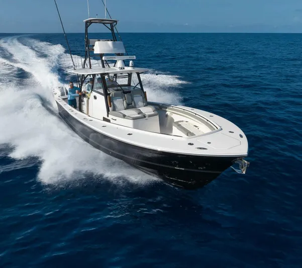  Yacht Photos Pics 2025 Regulator 41 CC boat cruising on open ocean waters.