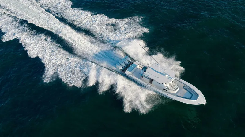  Yacht Photos Pics Aerial view of 2025 Regulator 41 CC boat speeding on ocean waters.