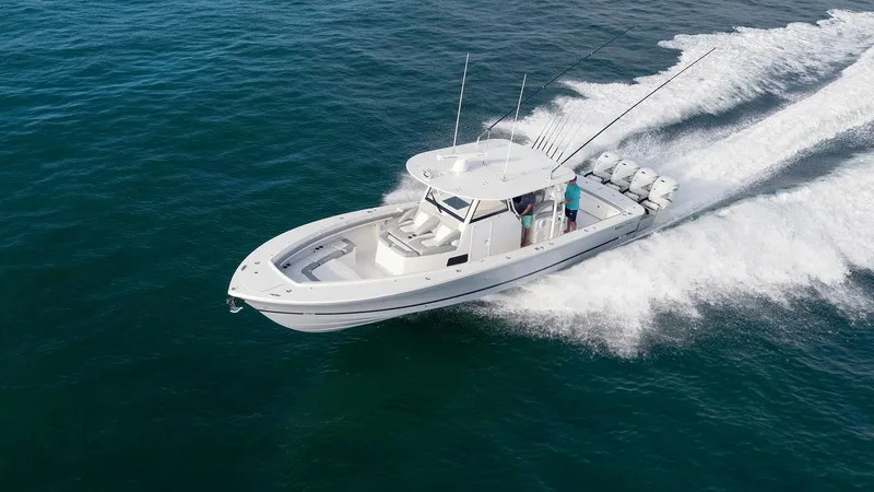  Yacht Photos Pics 2025 Regulator 41 CC boat cruising on open water, showcasing powerful engines and sleek design.
