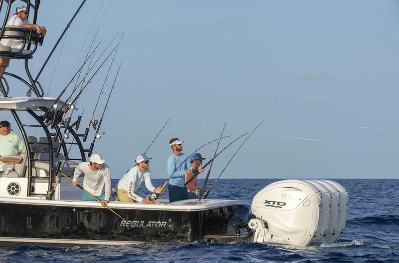  Yacht Photos Pics Fishing on a 2025 Regulator 41 CC boat with multiple rods in the ocean.