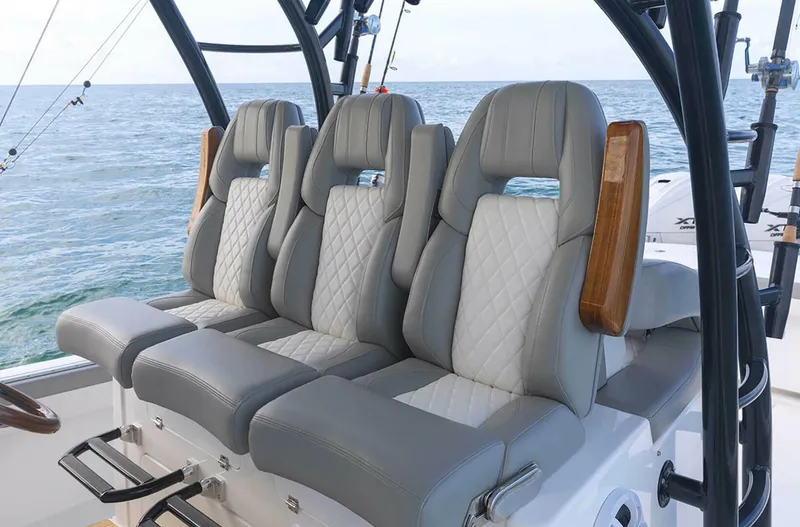  Yacht Photos Pics Luxurious seating on 2025 Regulator 41 CC boat with ocean backdrop.