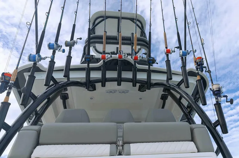  Yacht Photos Pics Fishing rods on a 2025 Regulator 41 CC boat against a cloudy sky.