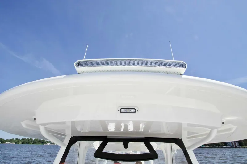  Yacht Photos Pics 2025 Regulator 41 CC boat roof with antennas against clear blue sky.