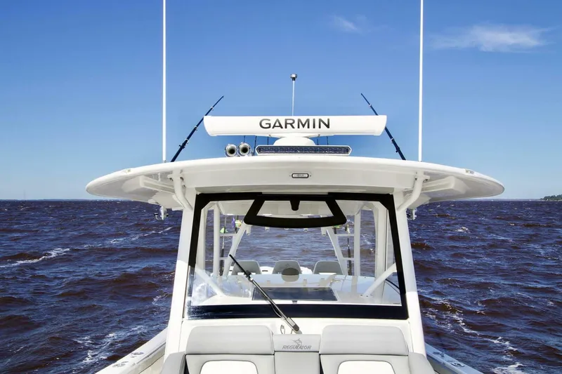  Yacht Photos Pics 2025 Regulator 41 CC boat on open water, featuring Garmin equipment.