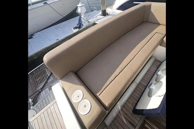 Sea Czar Yacht Photos Pics 2015 Fairline Targa 48 GT yacht with tan seating and wooden deck.