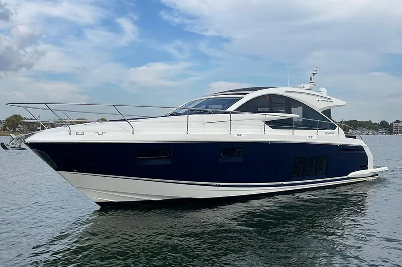 Sea Czar Yacht Photos Pics 2015 Fairline Targa 48 GT yacht on calm water under blue sky.