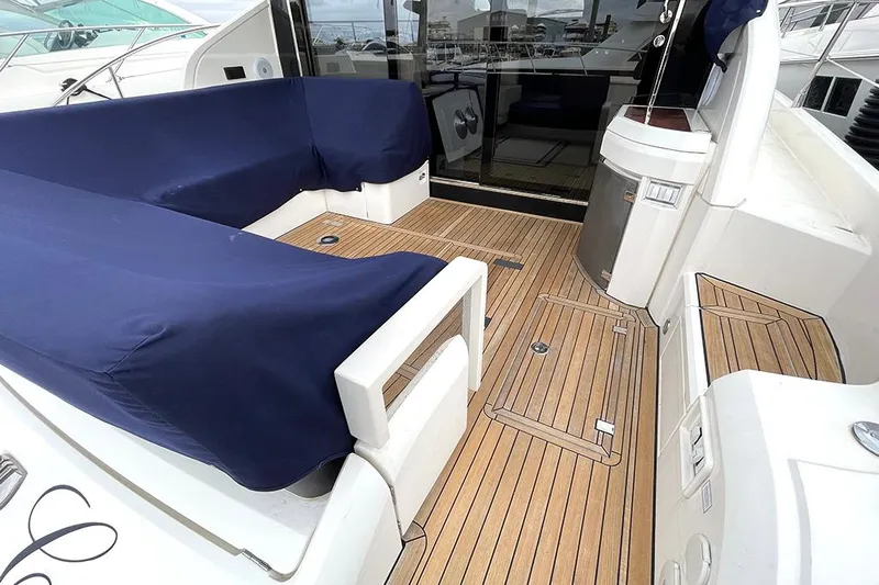 Sea Czar Yacht Photos Pics 2015 Fairline Targa 48 GT yacht with teak deck and covered seating area.