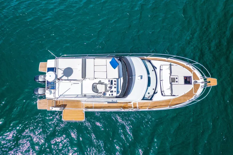  Yacht Photos Pics Aerial view of 2026 Beneteau Antares 11 yacht on clear blue water.