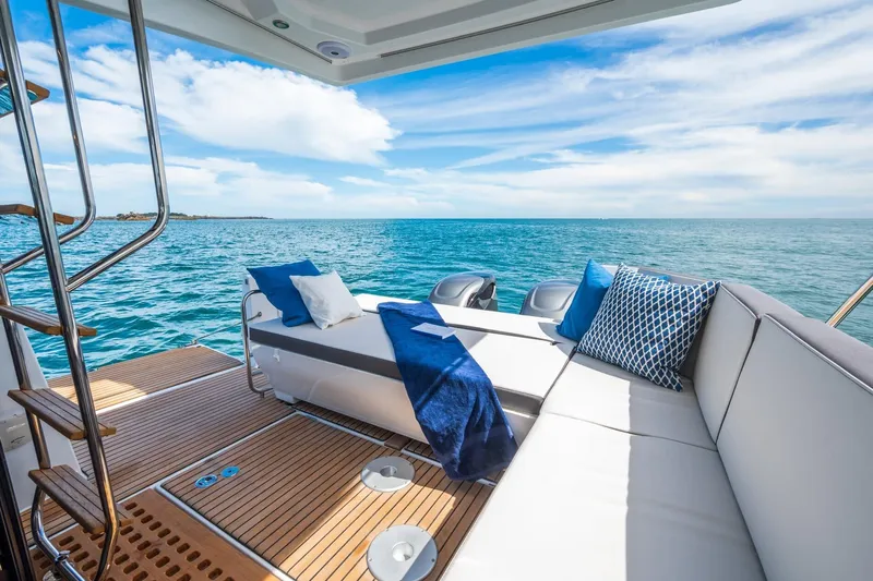  Yacht Photos Pics Luxurious 2026 Beneteau Antares 11 yacht deck with ocean view and comfortable seating.