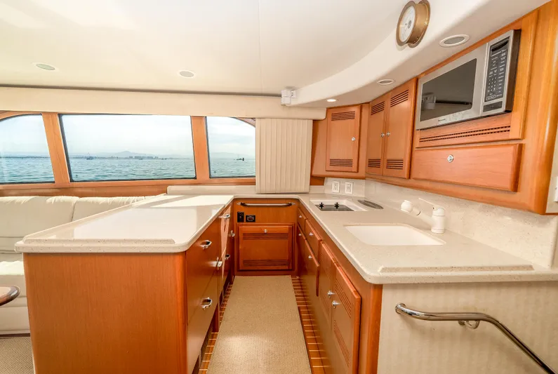 Dieguito Yacht Photos Pics Luxurious 2004 Cabo 48 Flybridge yacht interior with modern kitchen and ocean view.
