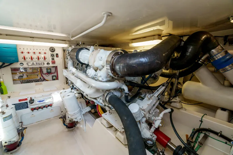Dieguito Yacht Photos Pics Engine room of a 2004 Cabo 48 Flybridge yacht, showcasing mechanical components and systems.